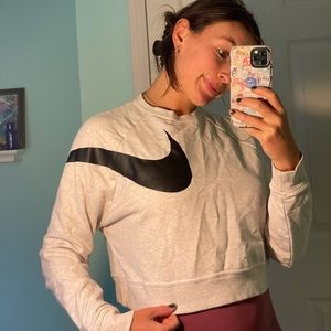 Nike cropped crew neck with wrap around Nike logo. Size S.